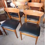 Four Danish teak dining chairs with vinyl seats