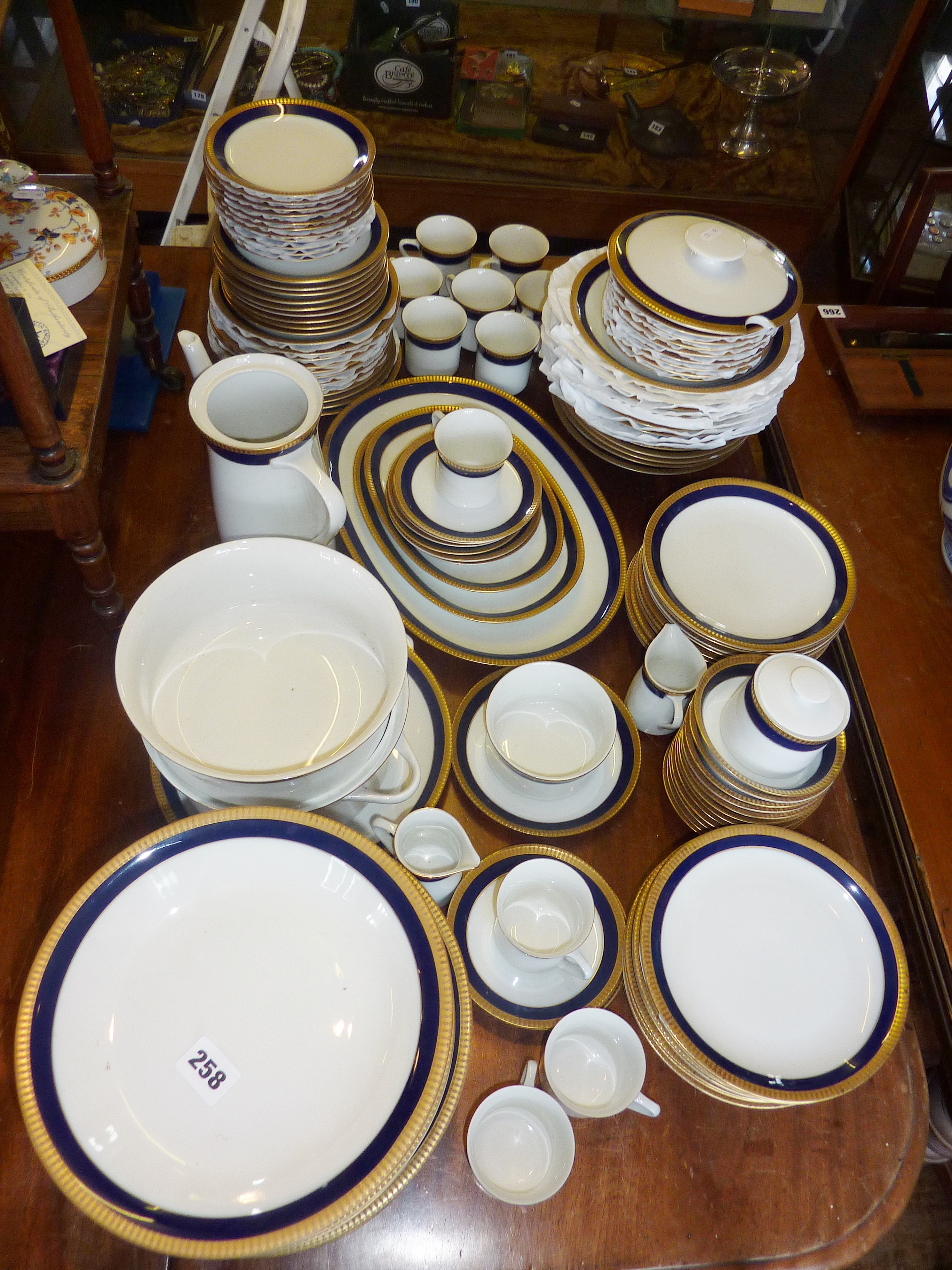 Extensive Thomas of Germany Dinner and Coffee Service, in white with blue and gold border