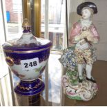 18th century English porcelain figure and an early English floral painted porcelain pot and