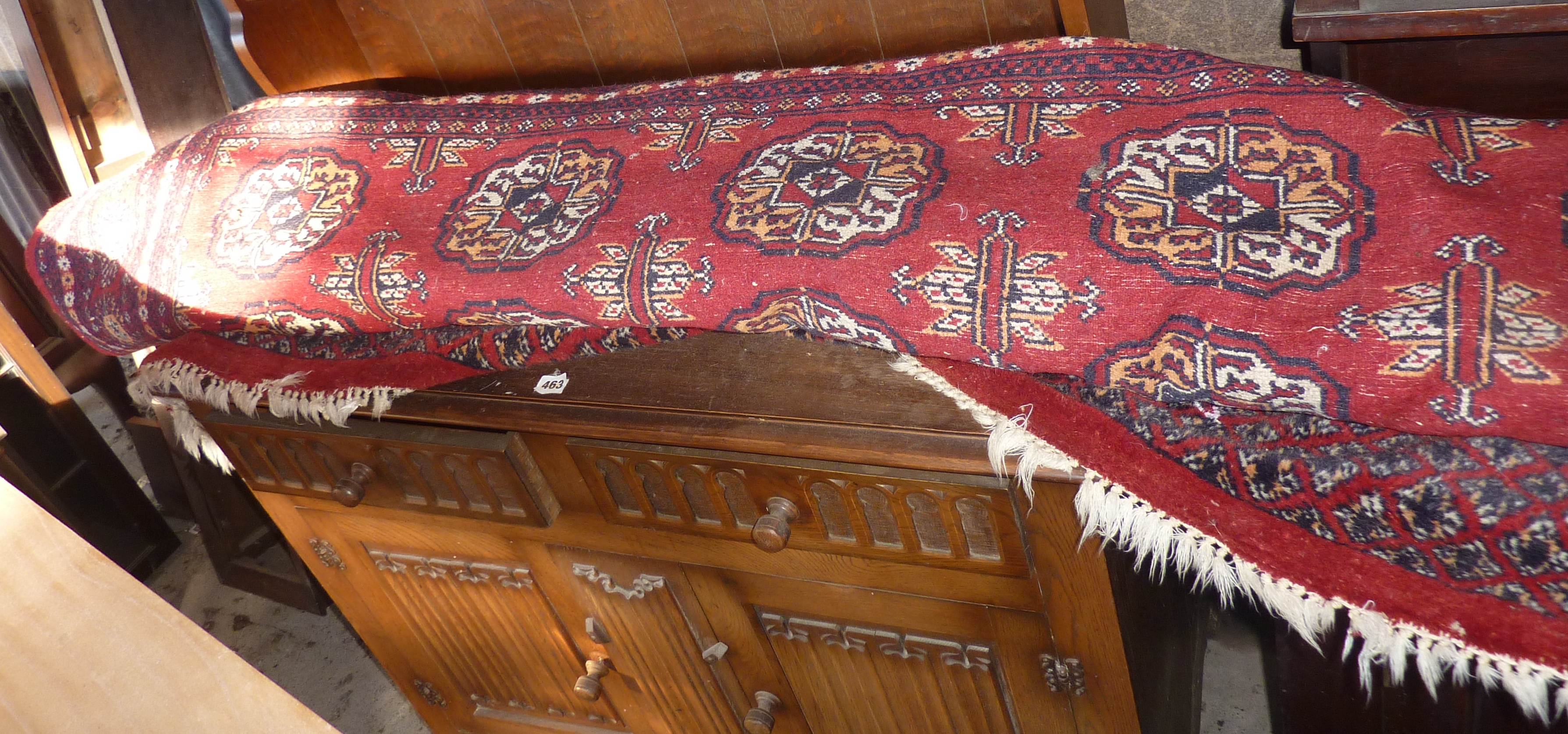 Large Persian style carpet/rug on red ground, approx. 8' x 12'