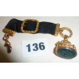 Victorian 9ct rose and yellow gold fob watch seal on black grosgrain ribbon with buckle. Seal has