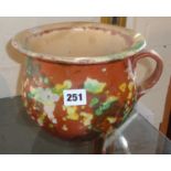17th/18th century terracotta chamber pot, with spatterware decoration, 7" high x 9" dia. with