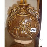 Chinese moon flask with raised horse and rider decoration, in brown treacle glaze