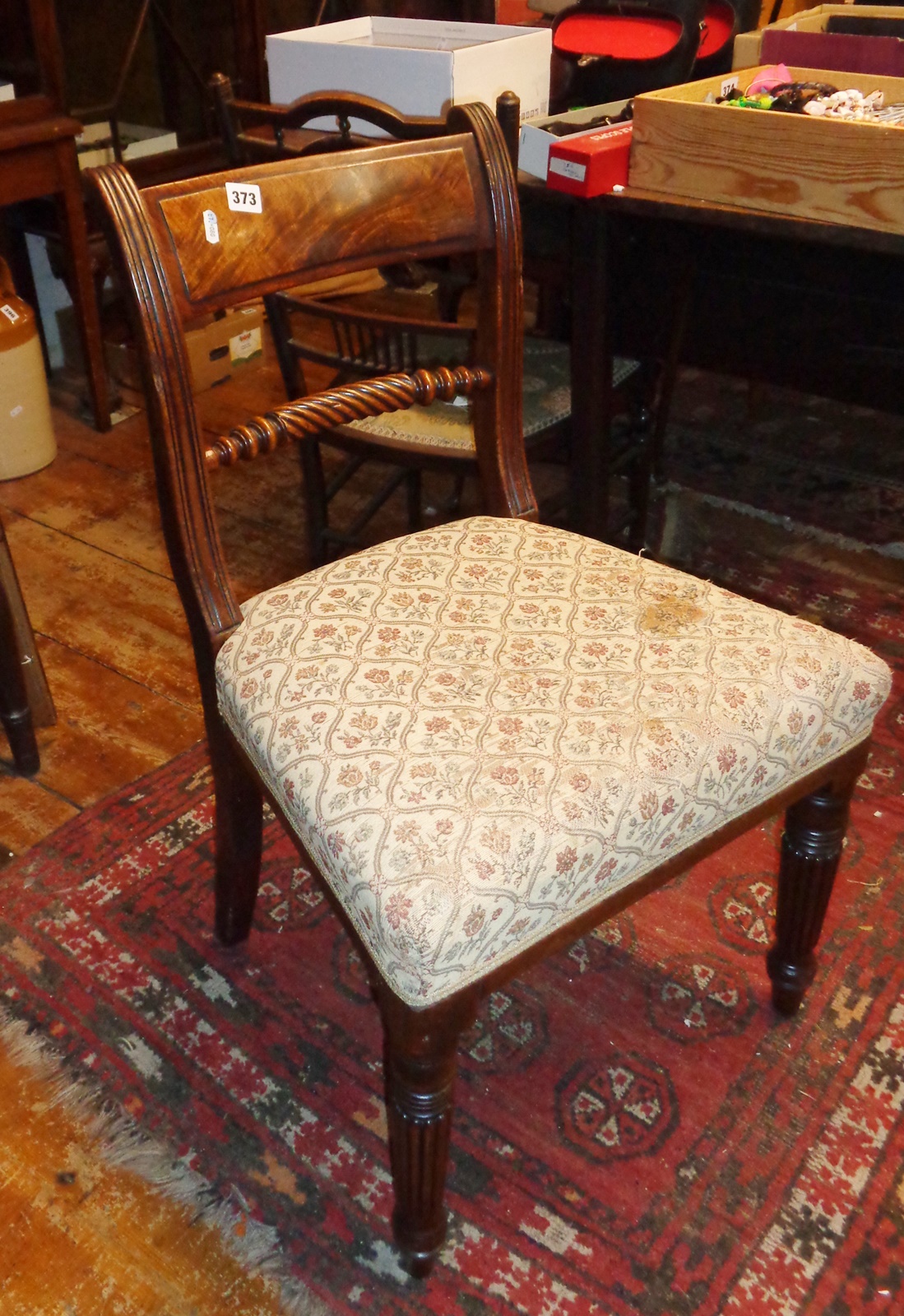 19th century mahogany dining chair on fluted legs with rope-twist back rail