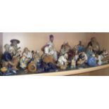 Collection of Japanese pottery 'Mud Men' figures including 'Go' players, fishermen and musicians