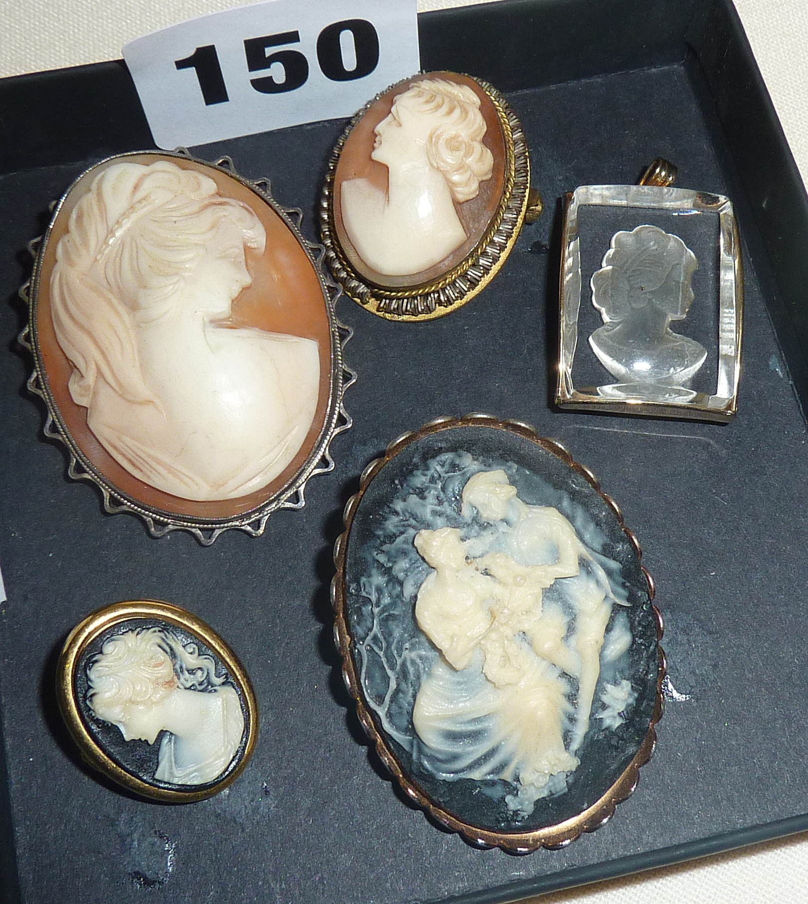 Four cameo brooches (two shell) and an intaglio pendant