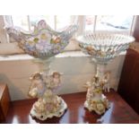 Austrian or German porcelain figural centrepieces, decorated with cherubs and flowers (both