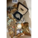 Box containing old enamel badges, cap badges, watch parts, fob medals, etc.