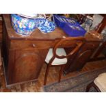 Victorian mahogany kneehole desk of three drawers above two doors