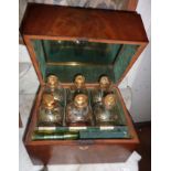 A George lll mahogany decanter box fitted with a collection of six gilt painted decanters and