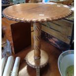Walnut occasional table on turned and carved centre column