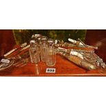 Silver plated and glass cutlery, Chinese bone salt and pepper, vanity bottles (one shelf)