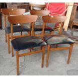 Set of four Danish teak dining chairs with black vinyl seats