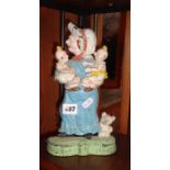 Humorous antique cast-iron painted doorstop depicting a lady with two babies
