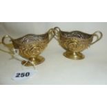Pair of Victorian silver salts decorated with a classical repoussé design, hallmarked for London