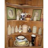 Four shelves of assorted pottery, stoneware and pictures