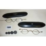 Two antique spectacles in papier mache cases, one pair gold rimmed, (untested), together with a