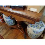 Victorian burr walnut foldover card table with central column on platform base and lion's feet