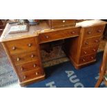 19th century mahogany kneehole desk having shaped top with leather above nine drawers