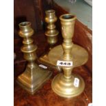 18th century brass candlestick with drip-pan and a pair of 19th century similar