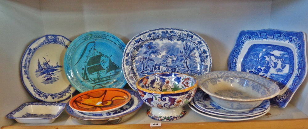 Shelf of assorted pottery including blue and white, Poole etc