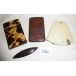 Edwardian tortoiseshell and leather card cases, together with a Victorian ivory Aide Memoire and a