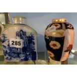 Chinese blue and white porcelain tea caddy and a similar Continental tea vase with crossed swords