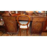 Victorian mahogany kneehole desk of three drawers above two doors