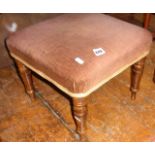 Upholstered footstool on turned legs