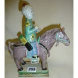 Chinese pottery polychrome figure on a horse (some evidence of restoration), approx 9" high