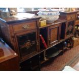 Ornate Edwardian inlaid rosewood sideboard, having marquetry panel door flanked by shelves and