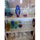 Two shelves of assorted glassware and a china teaset