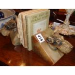 Pair marble bookends adorned with cold cast bronze Terrier heads and four Beatrix Potter books
