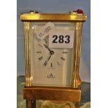 Brass carriage clock, made in England, working order with key