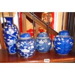 Three Chinese porcelain blue and white lidded ginger jars decorated with a prunus design and a