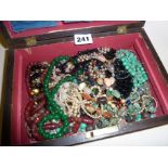 Old wooden box containing antique jewellery, beaded necklaces, etc
