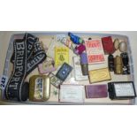 Old needle packets, thimble cases, other sewing accessories, spool holders, button and pin boxes