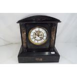 A French black marble cased mantel clock