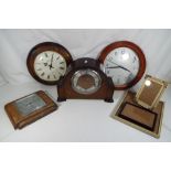 An oak cased mantel clock with Smiths mo