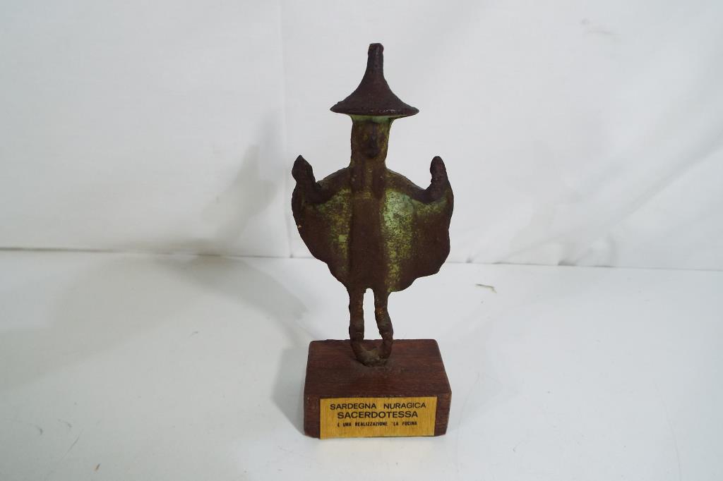 A small bronze statue depicting archaeol