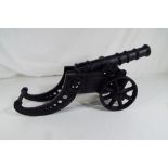 A cast iron cannon approx 19cm x 44cm x 14cm Est £20 - £30