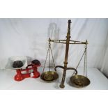 A brass weighing balance inscribed W&T Avery Ltd of Birmingham and a cast iron weighing balance