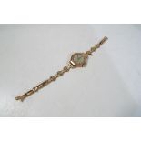 A lady's 9 carat rose gold octagonal case wristwatch on a decorative band, assay marks for 1947,