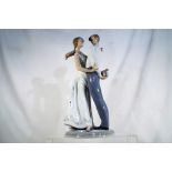 Lladro - A Lladro ceramic figural group # 6746 ' Love's Little Surprises' depicting a courting