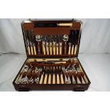 A wood cased canteen of cutlery by the Sheffield Silver Plate & Cutlery Co Ltd.