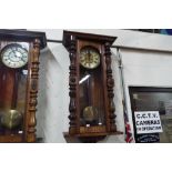 A large twin weight driven Vienna style wall clock,