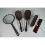 A George V silver hallmarked dressing table set comprising of three brushes,