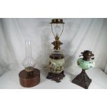 A collection of three oil lamps the two of which later converted for the use as table lamps (not