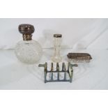 A collection of cut glass and silver lidded dressing table items,
