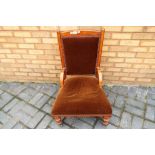 An upholstered nursing chair Est £20 - £30